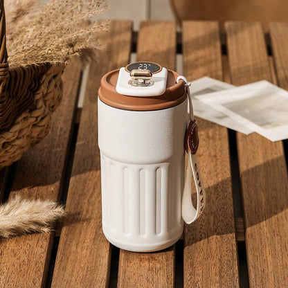 Smart digital thermos with LED temperature display in stainless steel finish color white with coffee brown lid.